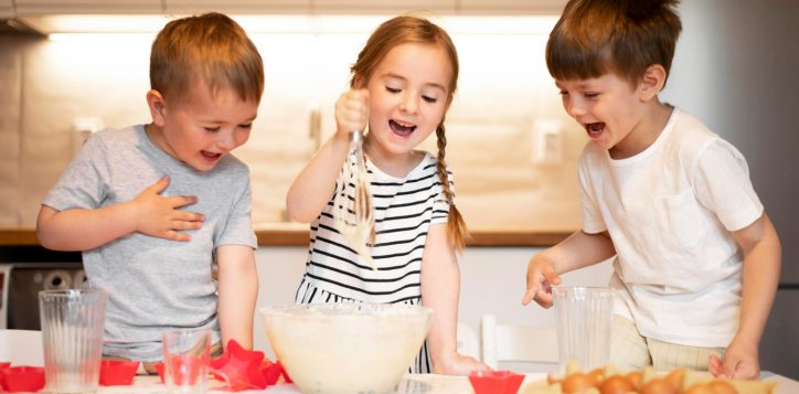 front-view-siblings-cooking-home-2
